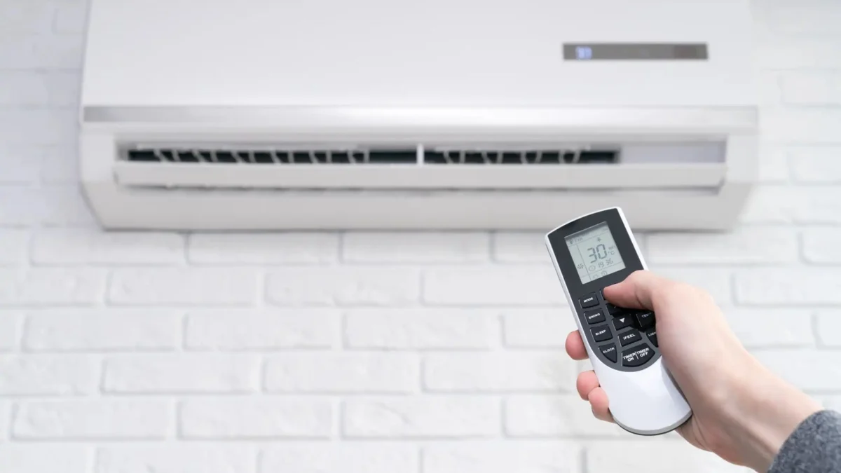 Air conditioning being set with a remote control
